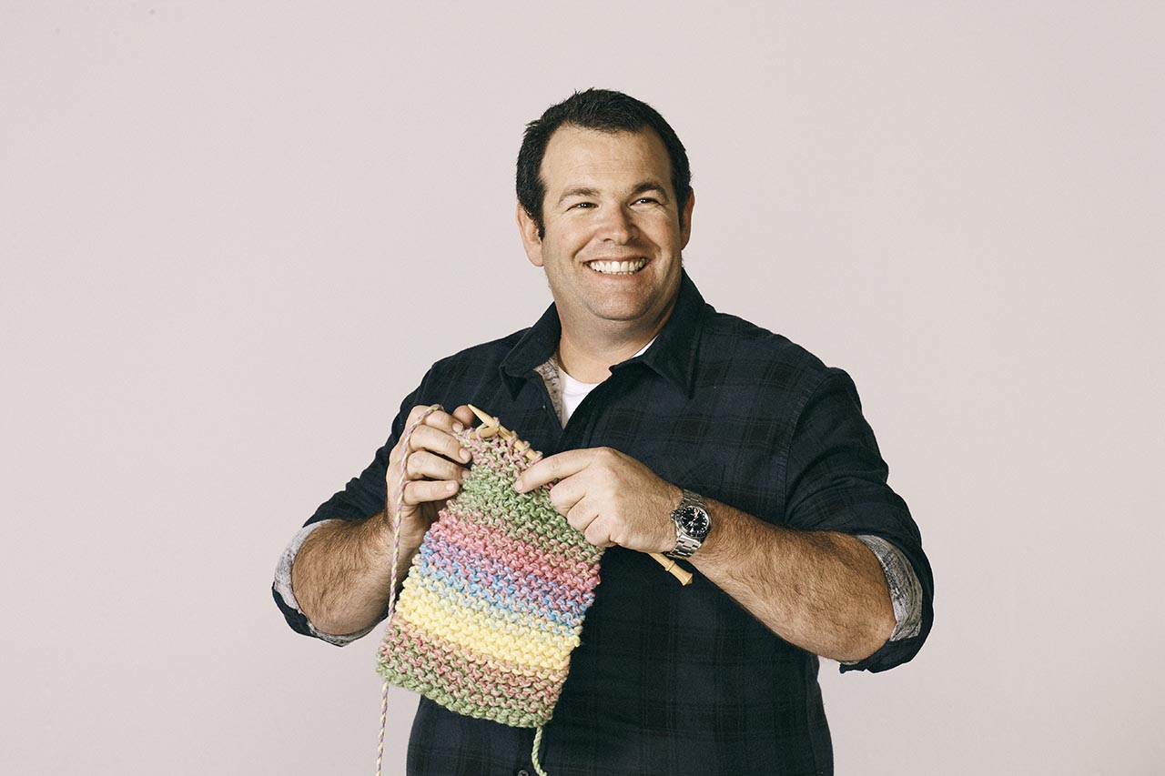 Gus knitting smile